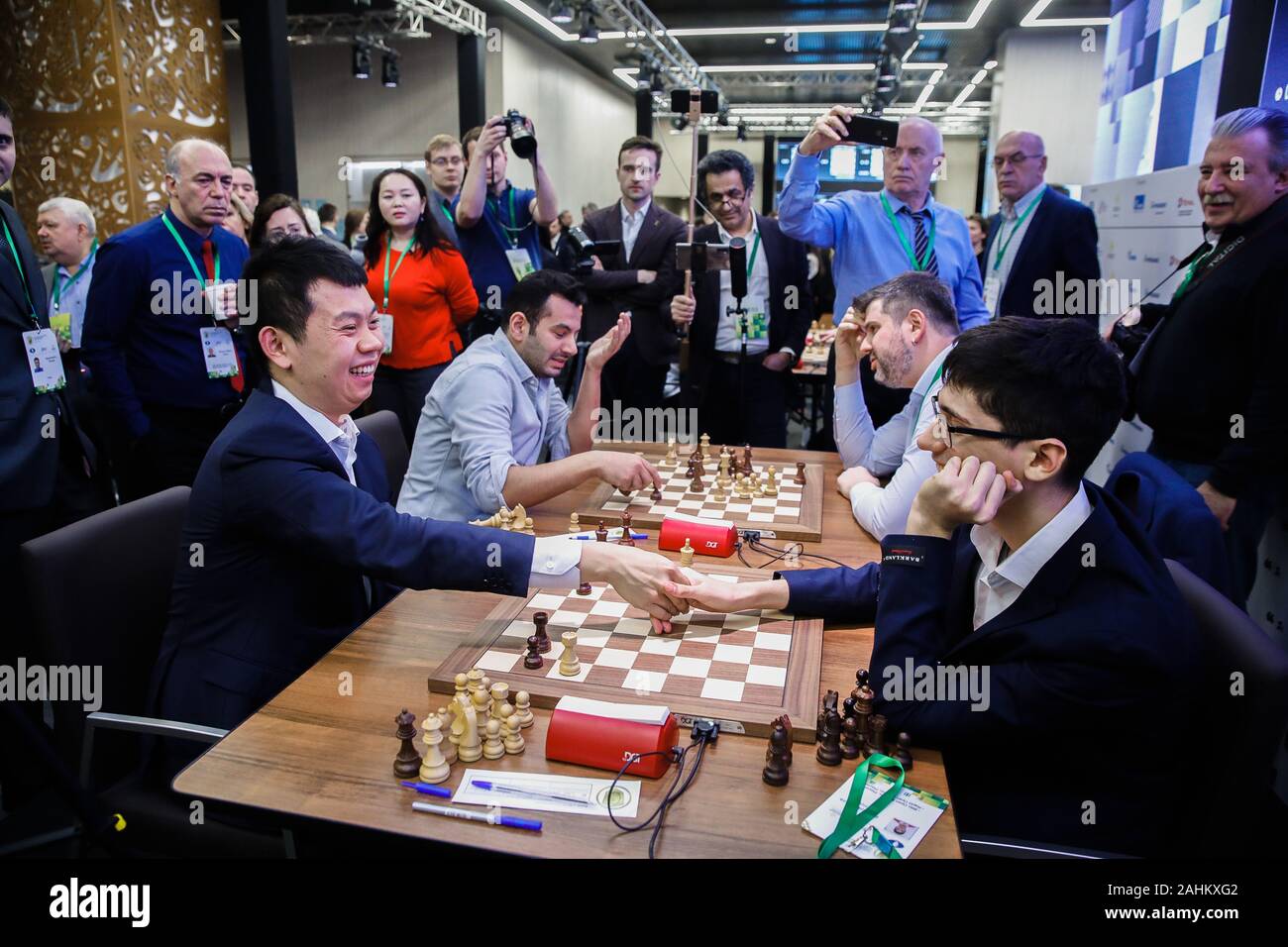 Moscow, Russia. 30th Dec, 2019. Wang Hao (L) of China and Alireza Firouzja  participating under the FIDE flag shake hands after the Blitz Open final at  2019 King Salman World Rapid 