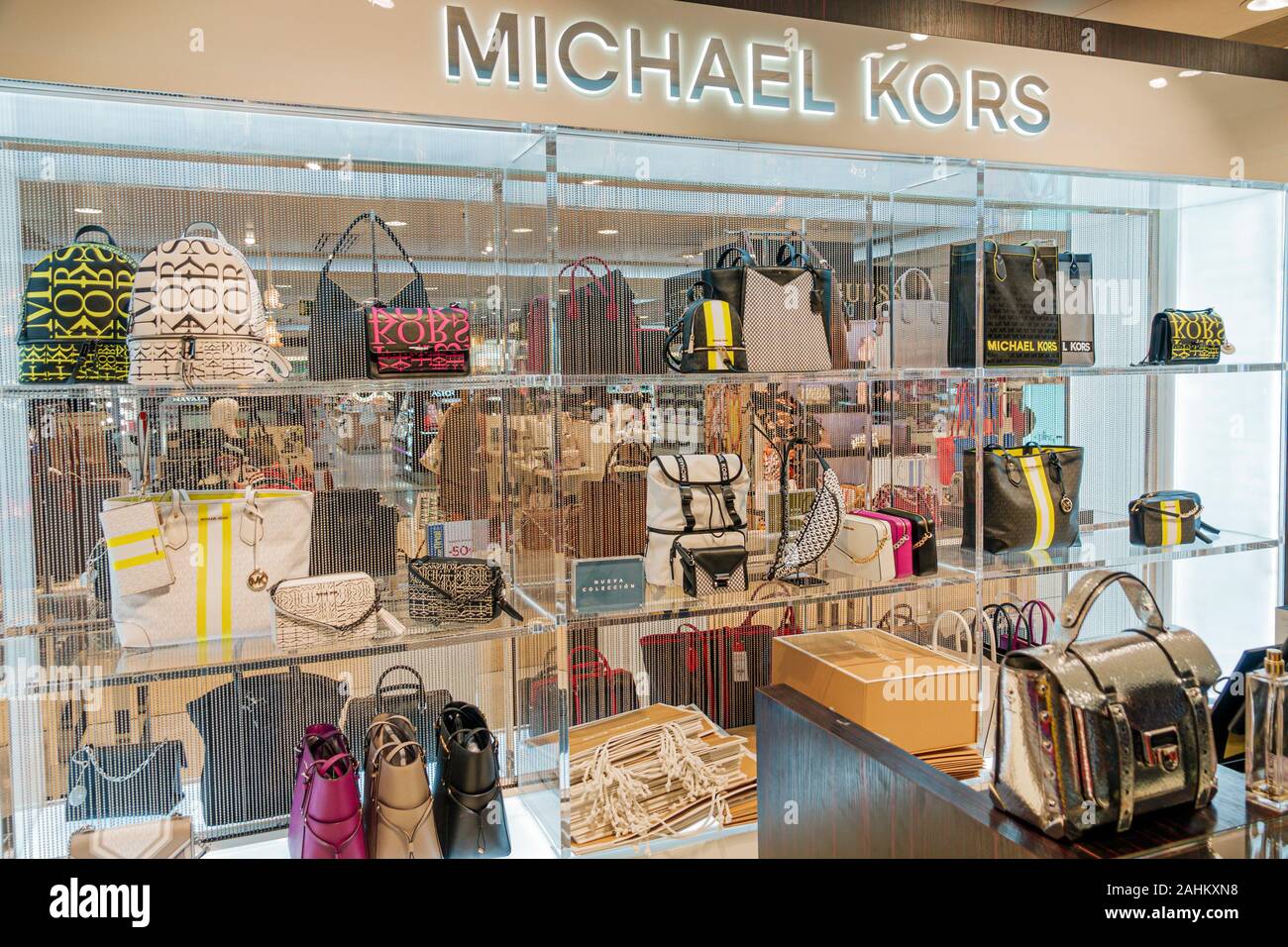 Tarragona Spain Hispanic Catalonia El Corte Ingles,department store,interior inside,shopping,handbags,designer,Michael Kors,display sale,ES190826091 Stock Photo