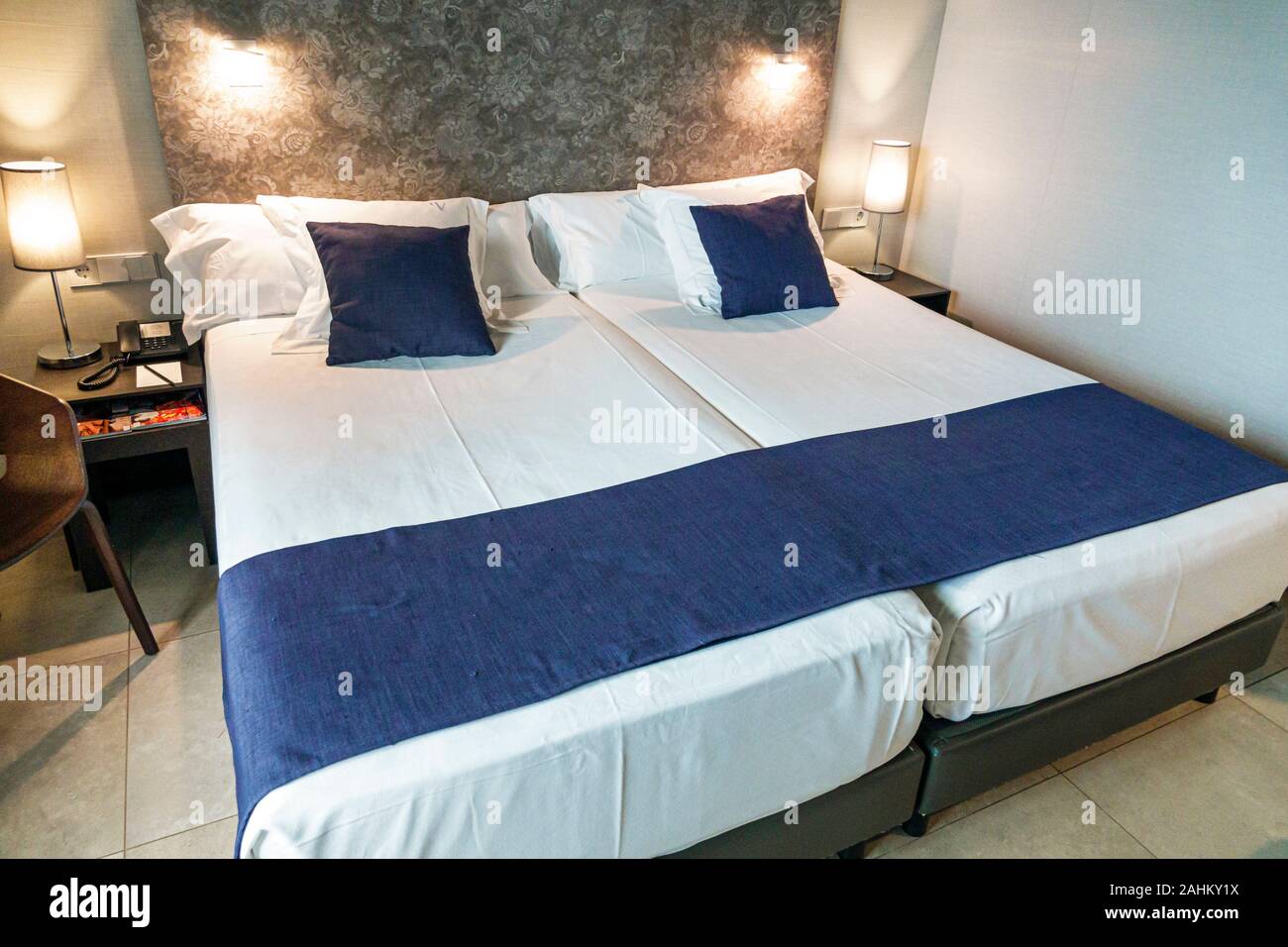 Valencia Spain Hispanic,Ciutat Vella,old city,historic district,Vincci Mercat,hotel,guest room,bed,twin beds joined together,bedding,ES190827063 Stock Photo