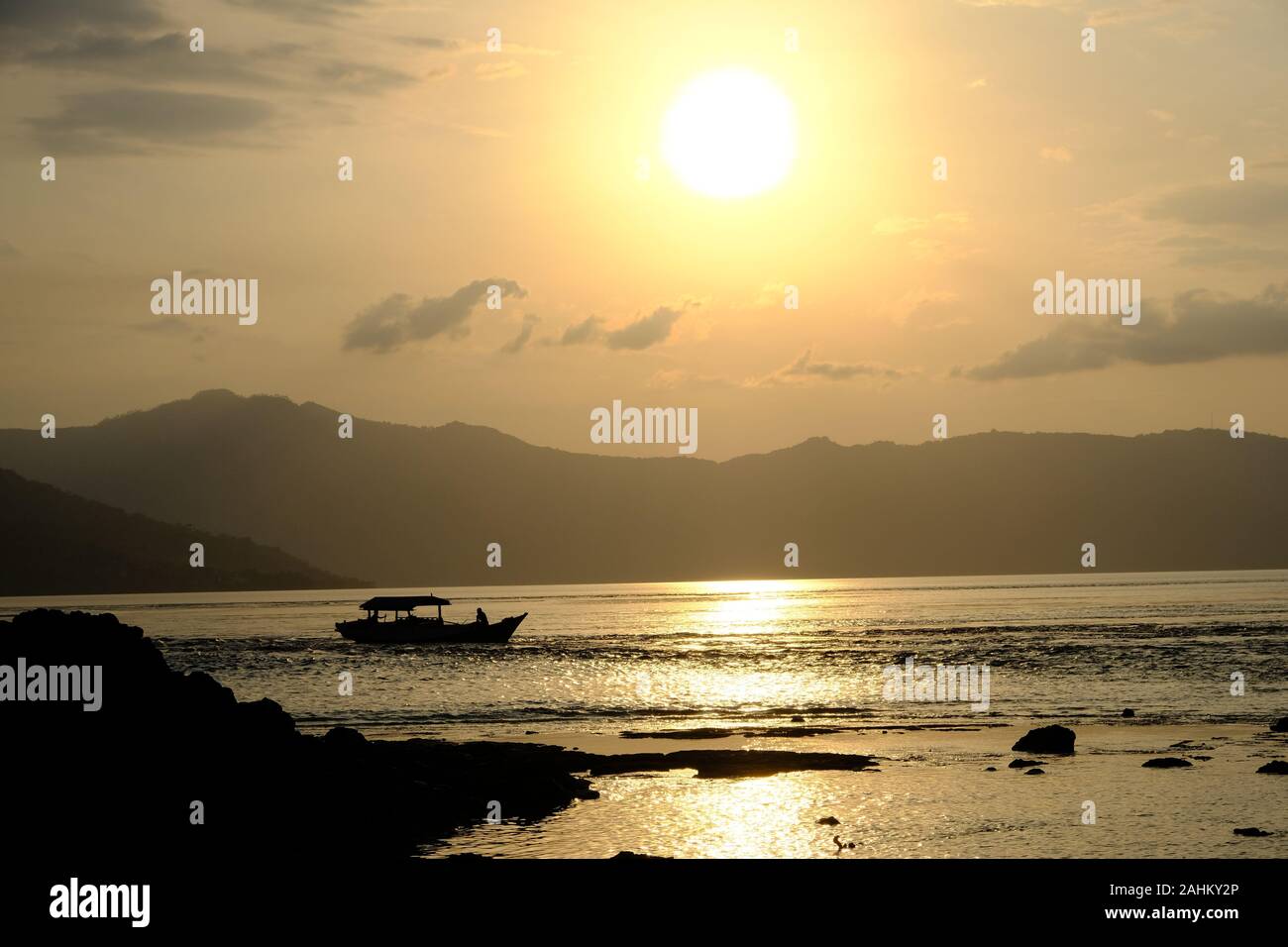Indonesia Alor - Wonderful Coastlines fishing boat at sunset Stock Photo