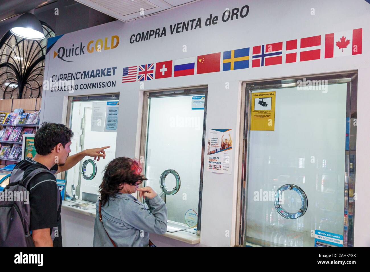 Valencia Spain Hispanic,Ciutat Vella,old city,historic district,Carrer de Sant Vicent Martir,money currency exchange,anodized cashier window speak-thr Stock Photo