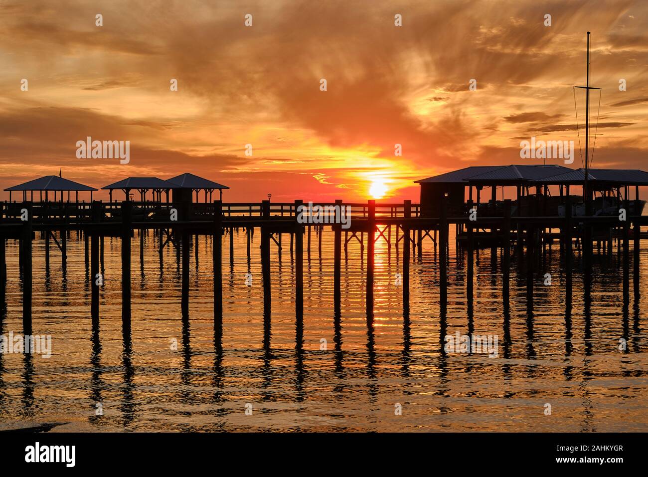 Sunset over Mobile Bay with boat houses at Point Clear Alabama near Fairhope Alabama, USA. Stock Photo