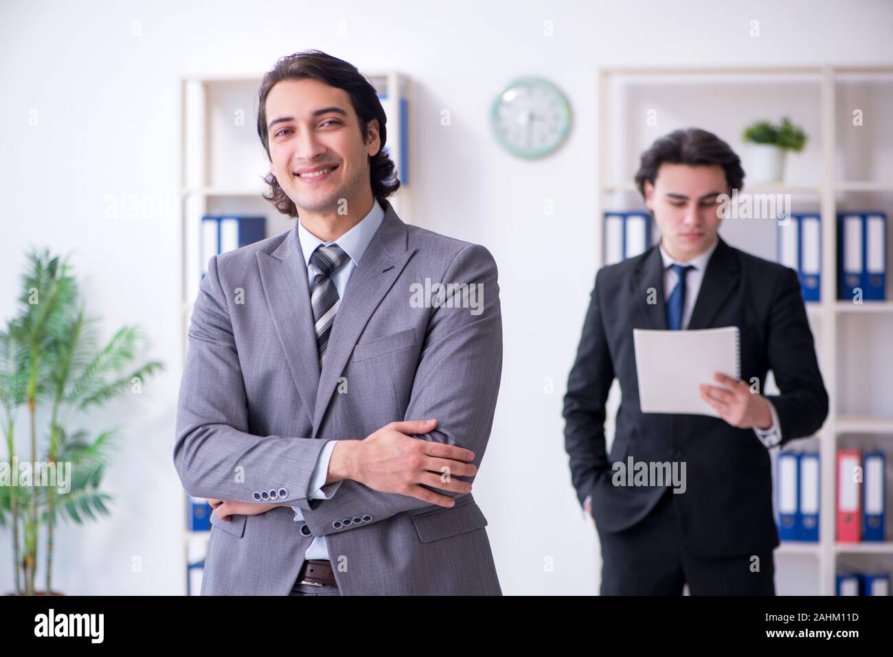 The two young businessmen meeting in the office Stock Photo - Alamy