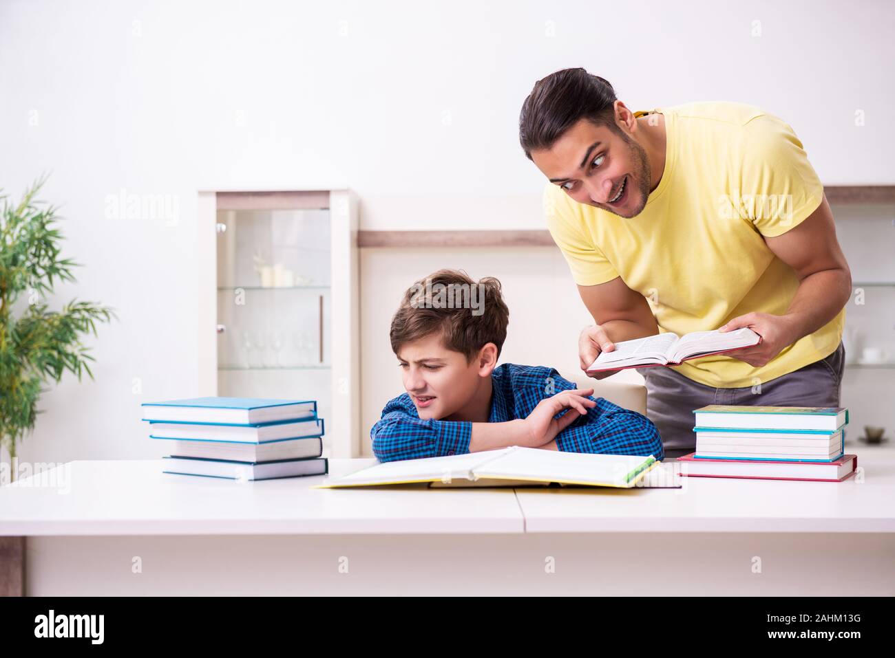 The father helping his son to prepare for school Stock Photo - Alamy