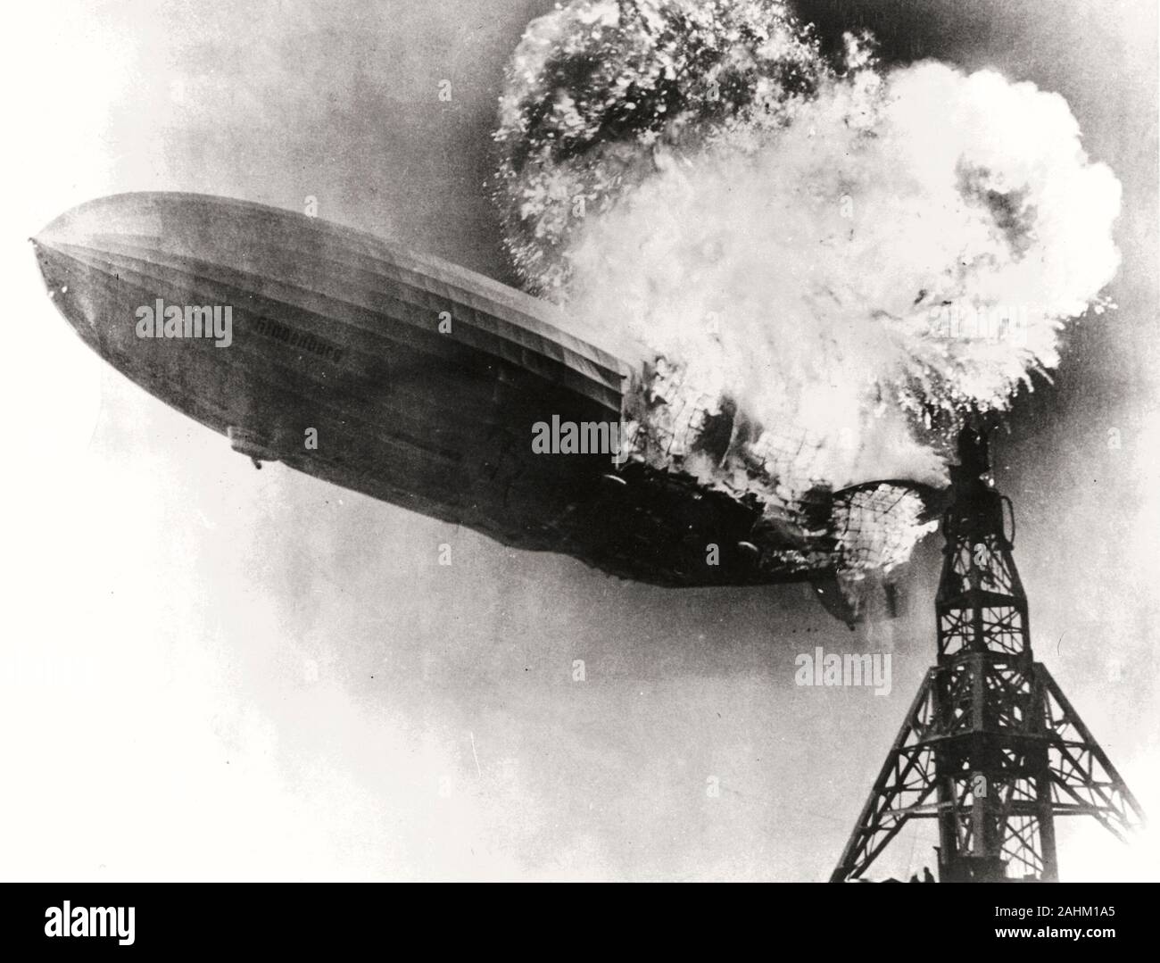 The Zeppelin LZ 129 Hindenburg catching fire on May 6, 1937 at Lakehurst Naval Air Station in New Jersey. Stock Photo