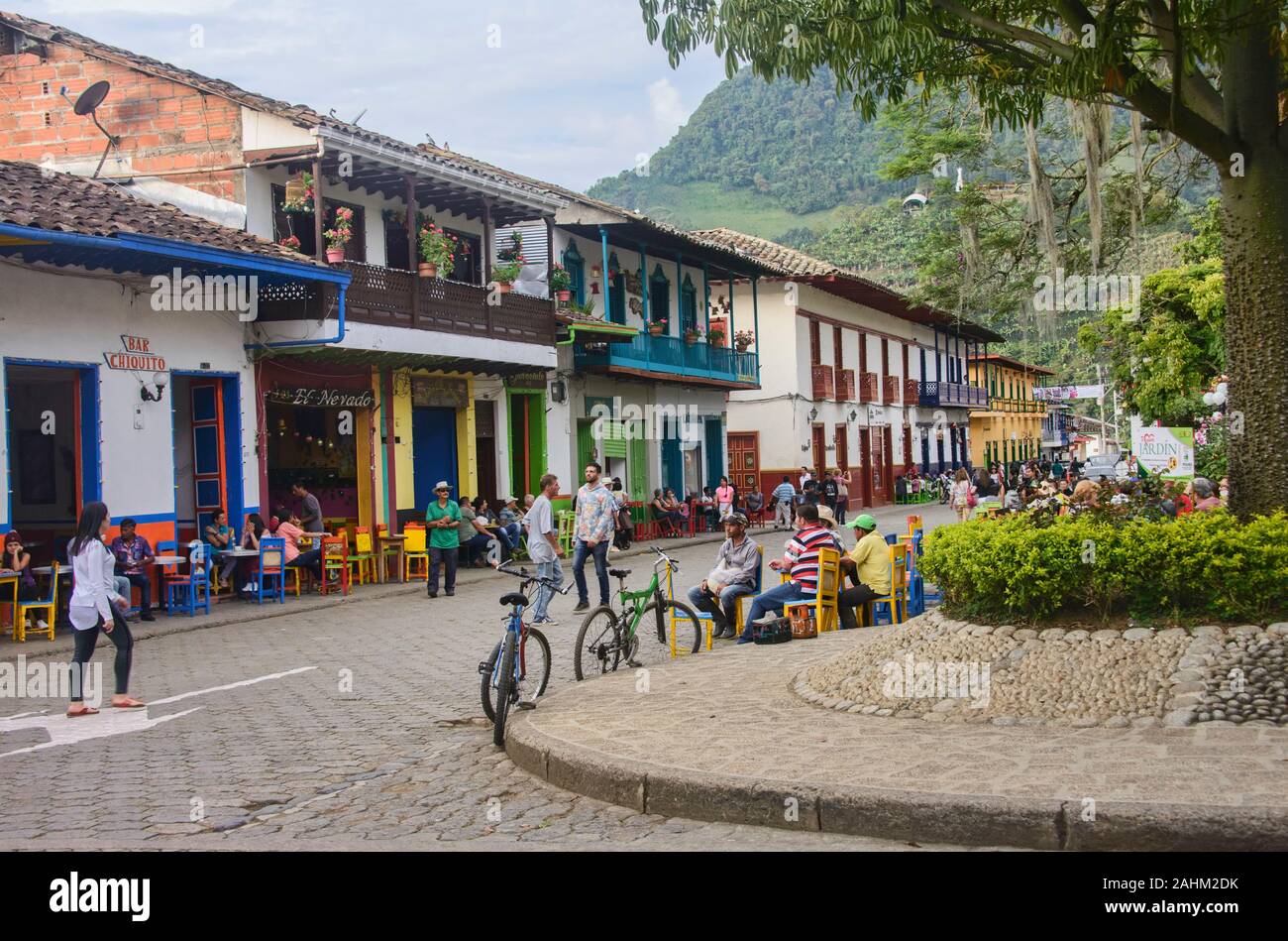 Enjoying coffee in the main plaza of colourful Jardin, Antioquia, Colombia Stock Photo