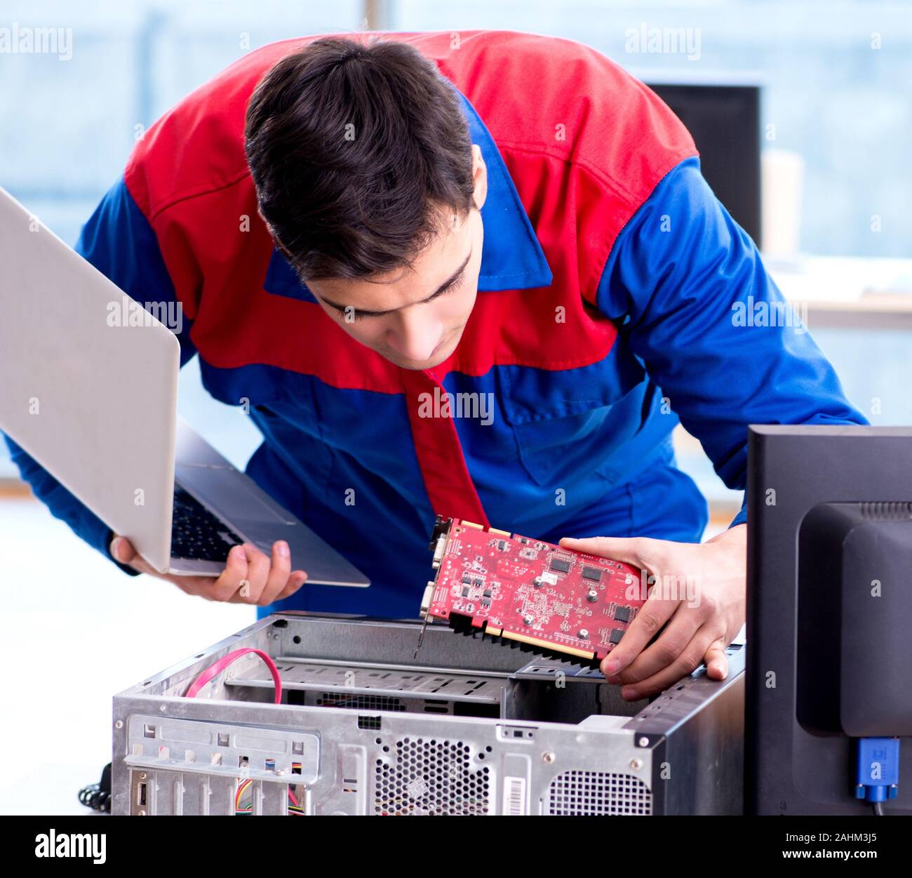 Computer repairman specialist repairing computer desktop Stock Photo ...