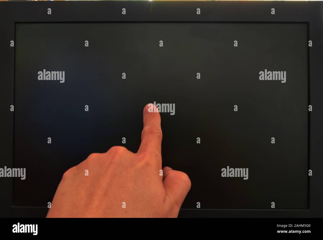 human finger touching on black computer screen Stock Photo - Alamy