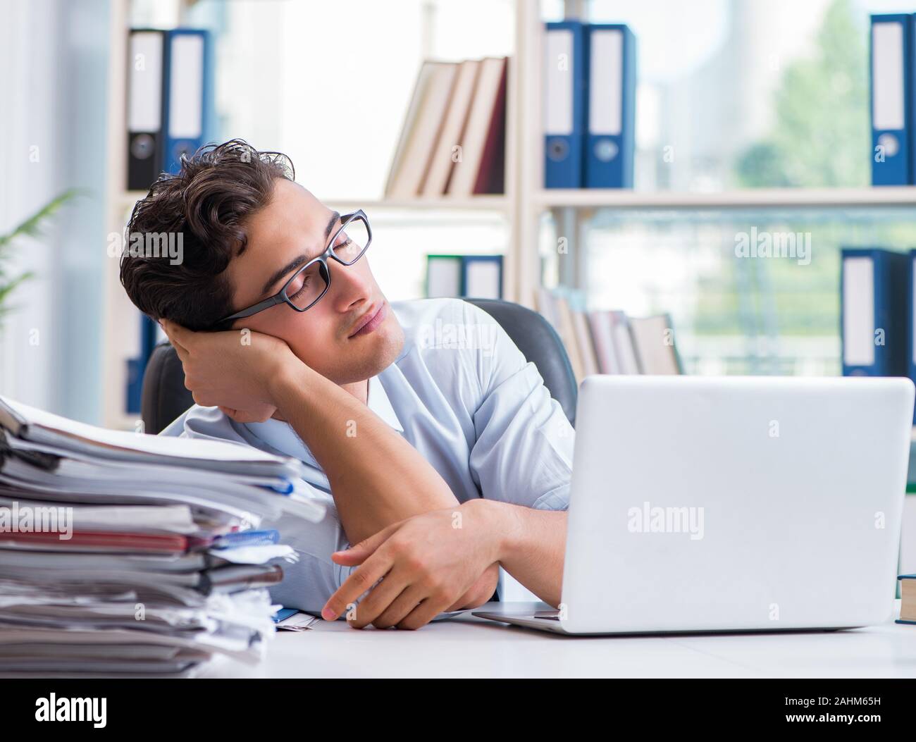 The tired exhausted businessman sitting in the office Stock Photo - Alamy