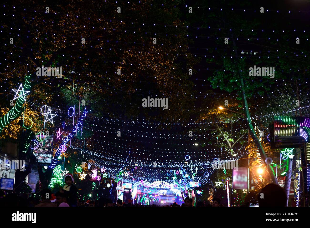 Christmas lights decoration at Park street, Kolkata and lots of people walking during the Christmas Stock Photo