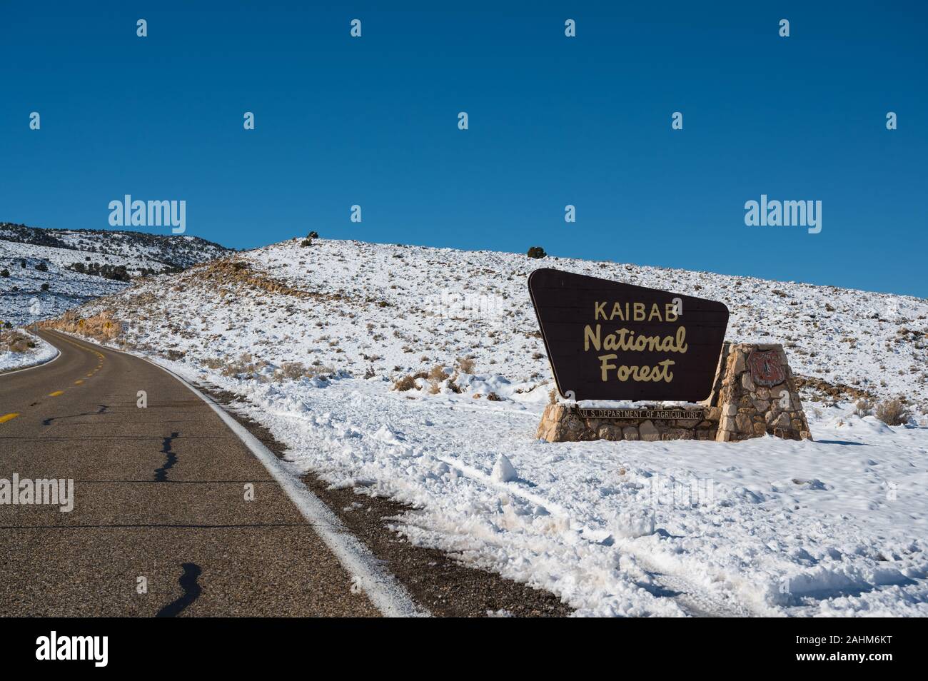 Kaibab National Forest sign in a snow covered winter landscape Stock Photo