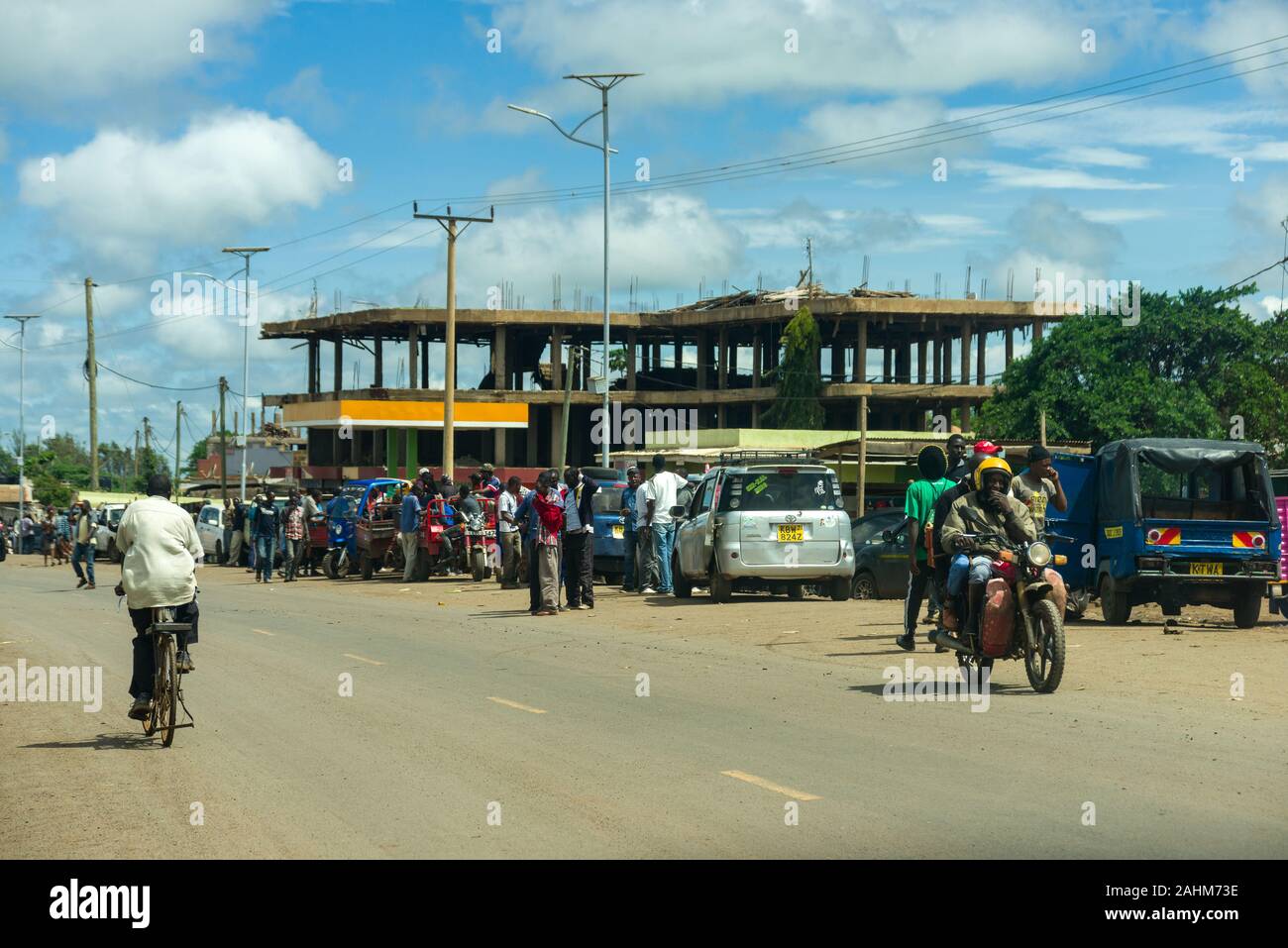 Locals going about daily life by the road, Kimana, Kenya Stock Photo