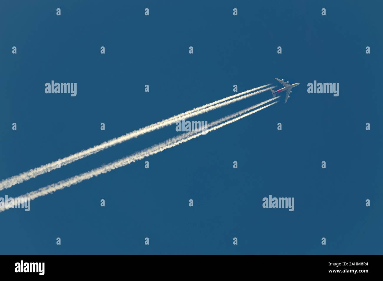 Airliner leaving a contrail Stock Photo