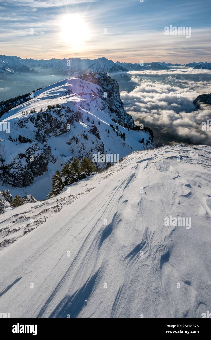 snow drift in the swiss alps in front Niederhorn and Niesen Stock Photo