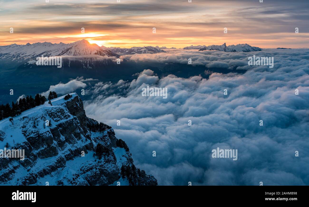 sea of fog in front of Mount Niesen at a winter sunset seen from Niederhorn Stock Photo
