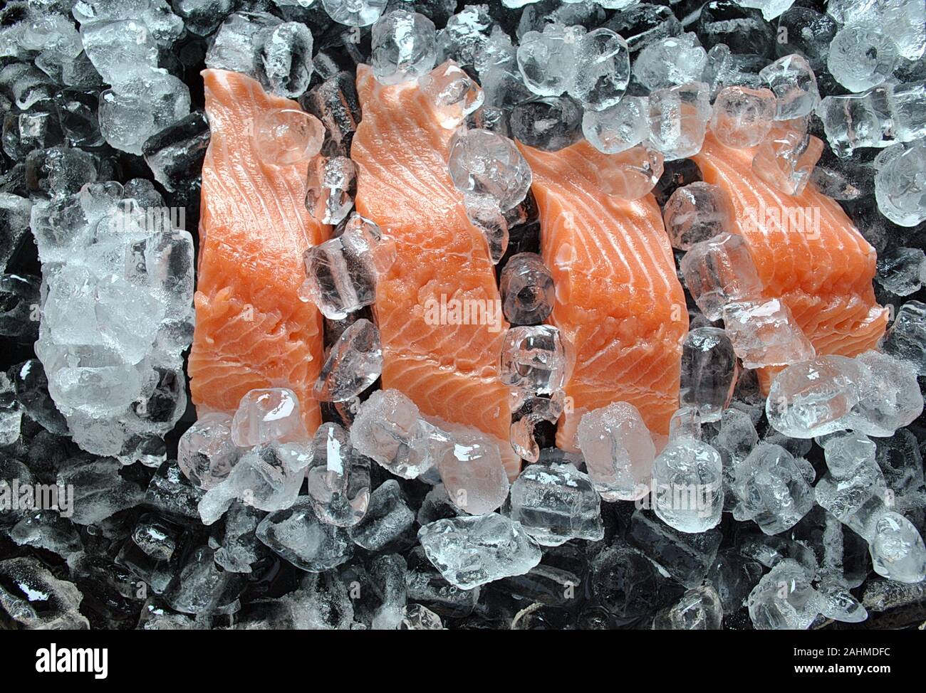 Fresh salmon steaks . Fresh salmon steaks on ice and black background ...