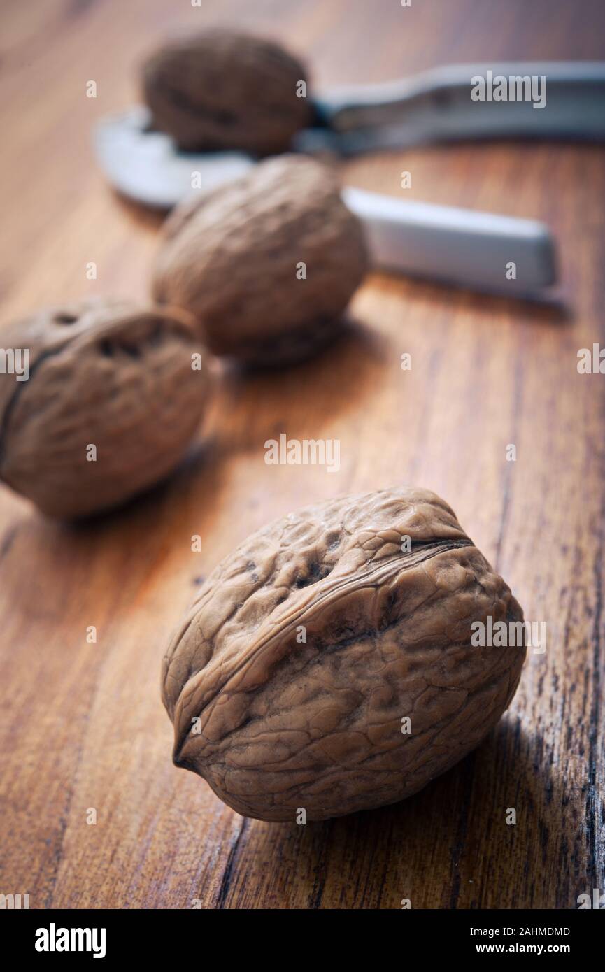 whole walnuts and nutcracker Stock Photo Alamy
