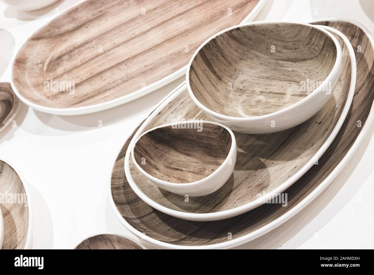 multi-colored dishes utensils on a white background Stock Photo