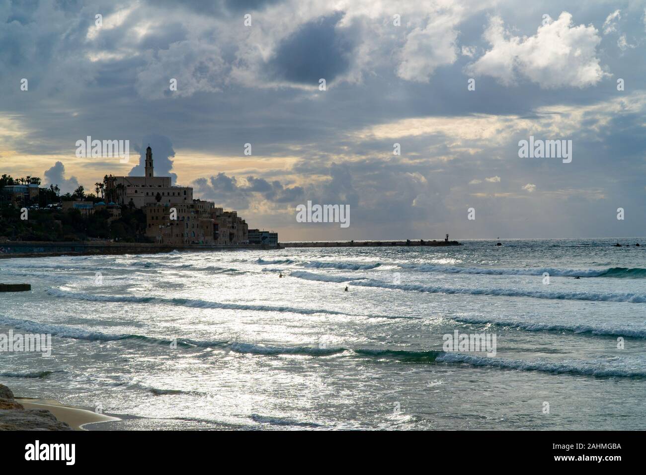 Israel, Tel Aviv, Jaffa, The silhouette of the Old Jaffa and the entrance to the port at sunset Stock Photo