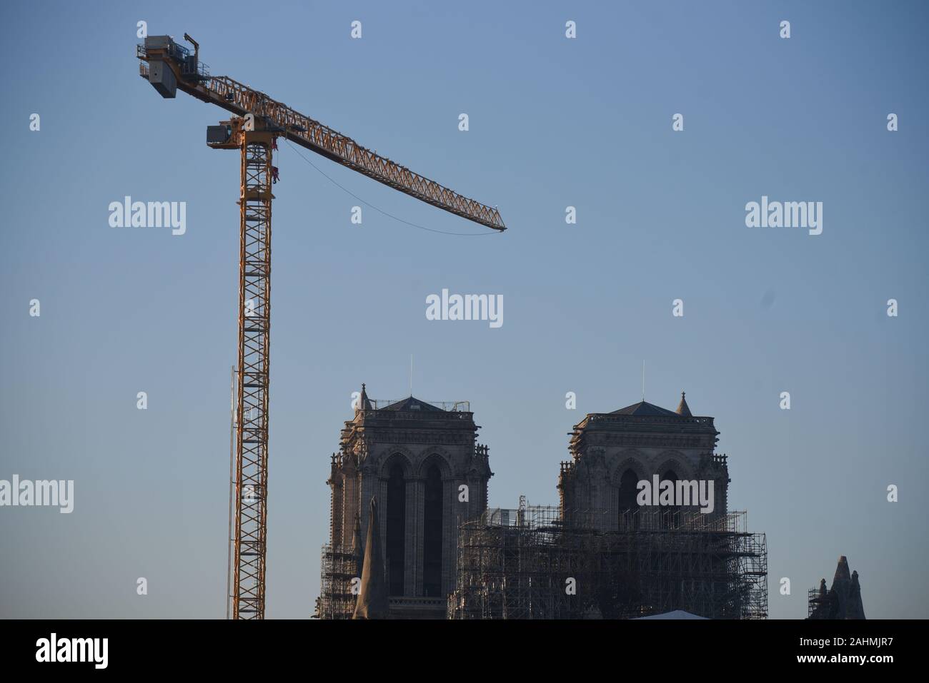 *** STRICTLY NO SALES TO FRENCH MEDIA OR PUBLISHERS *** December 30, 2019 - Paris, France: A giant crane has been erected near Notre Dame cathedral in order to dismantle the old scaffolding structure that collapsed during the April 15 fire. Stock Photo