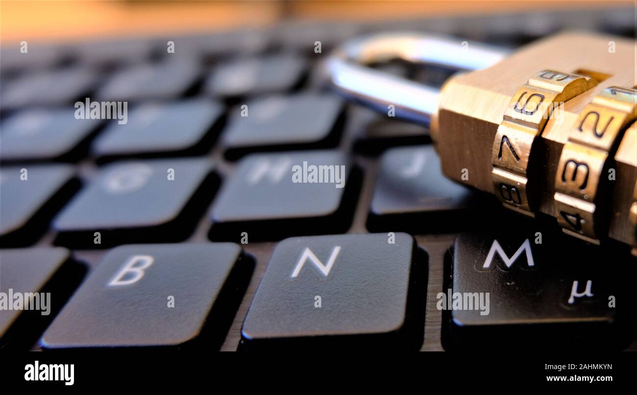 Lock for security placed on PC keyboard Stock Photo