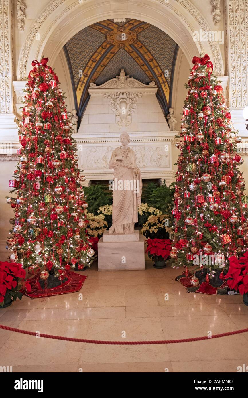 Two of over a dozen Christmas trees decorating the Breakers, a Vanderbilt mansion and landmark in Newport, Rhode Island. Stock Photo