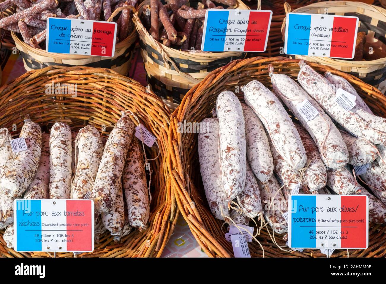 French sausages and cured salamis for sale on market day, Place Allende, Morlaix, Finistère, Brittany, France Stock Photo