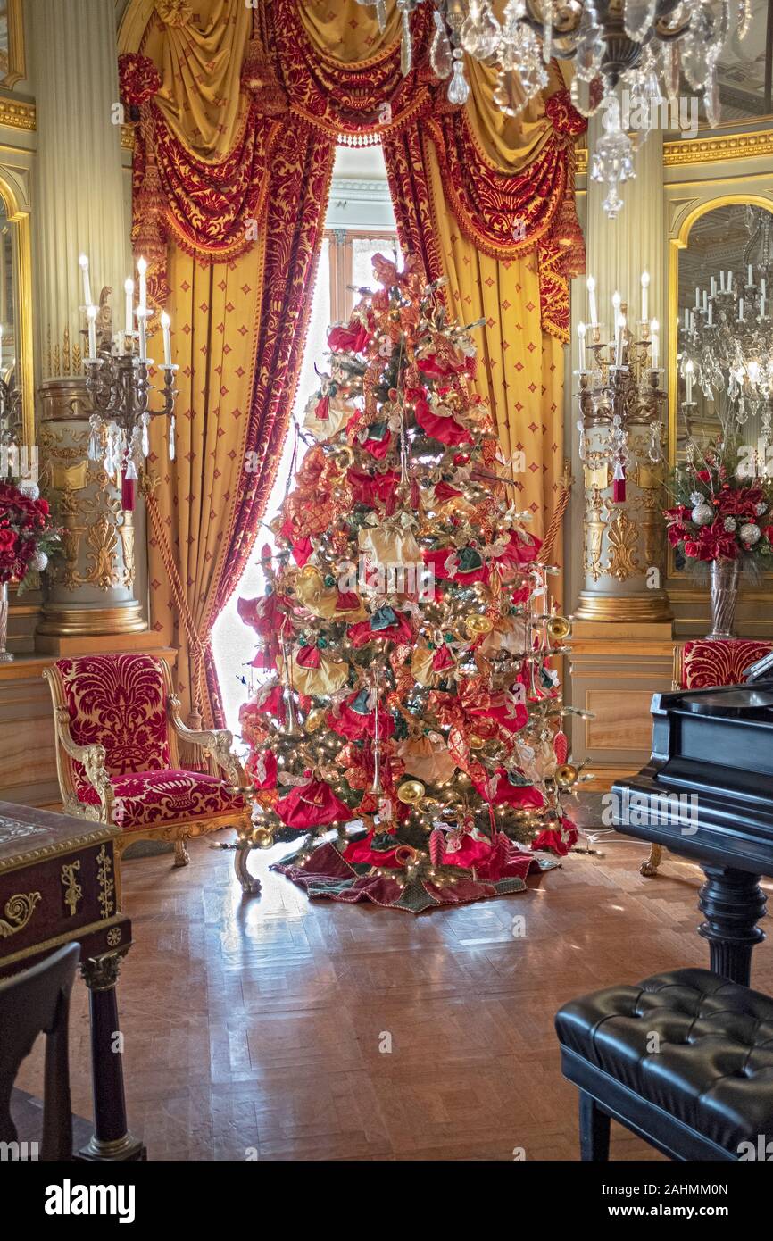 A beautifully decorated Christmas tree in the Music Room on the second floor of the Breakers mansion in Newport, Rhode Island. Stock Photo