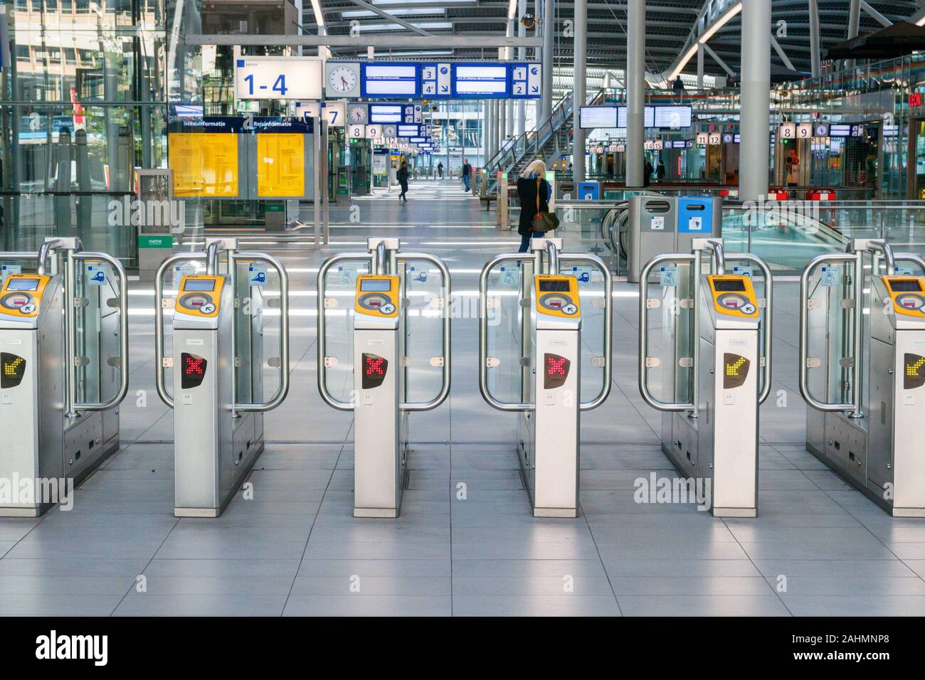 Line of electronic ticket barriers in an empty Centraal Station hall. Utrecht, The Netherlands. Stock Photo