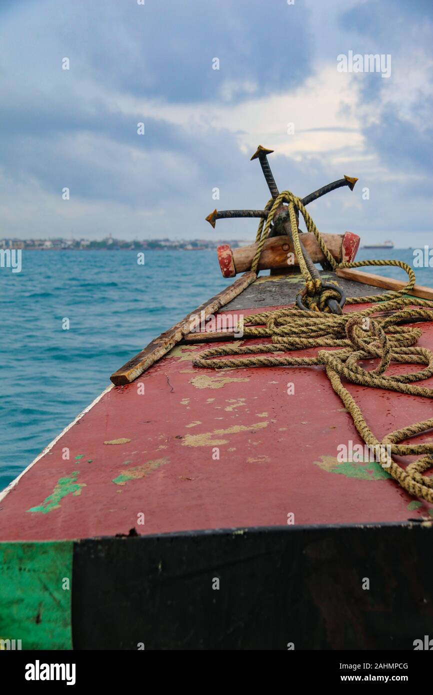 Traditional local boat sailing to Prison Island, for a tourist day trip, Zanzibar, Tanzania, East Africa Stock Photo
