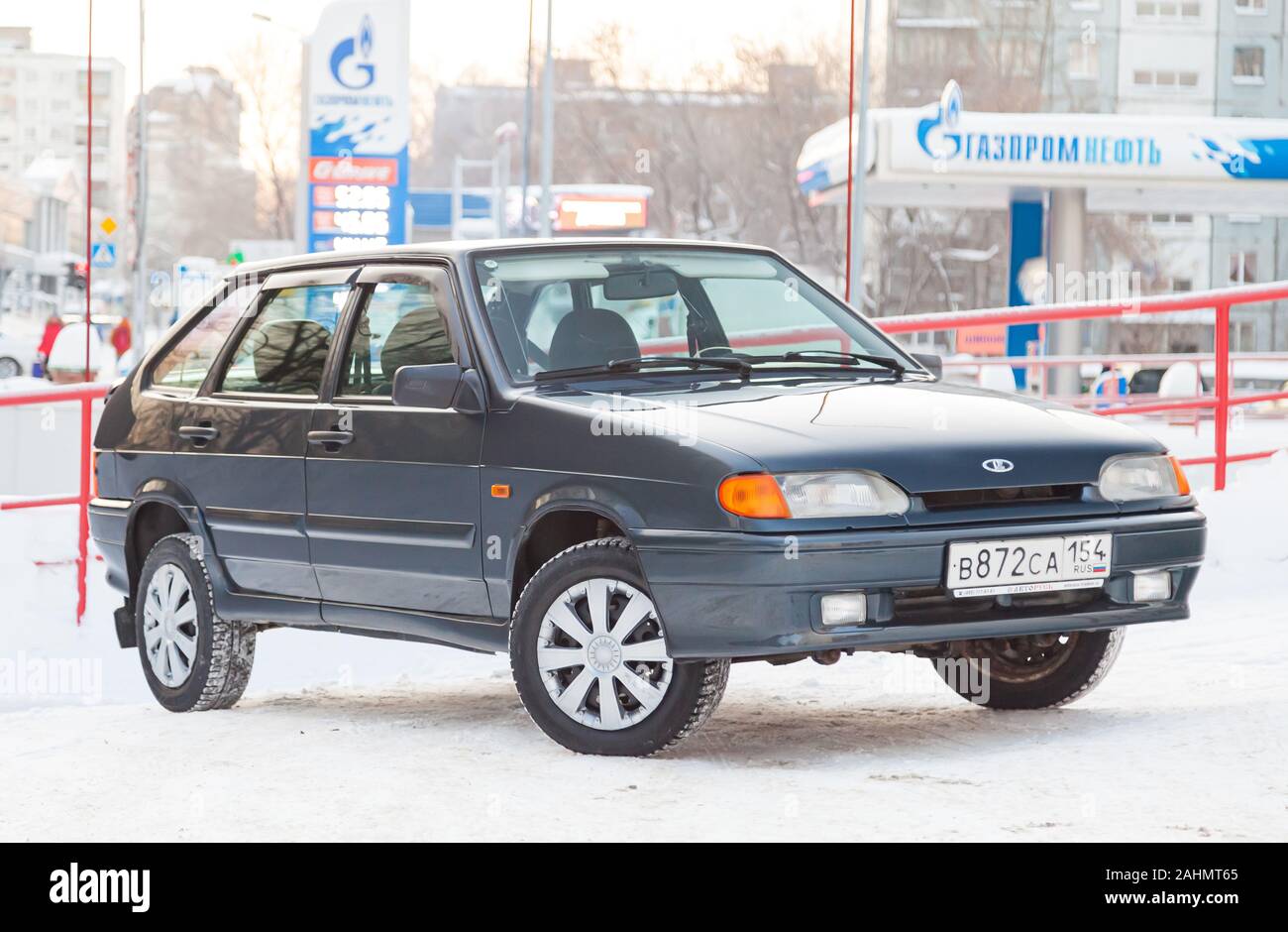 Novosibirsk, Russia - 12.27.2019: Green lada 2114 year front view with dark gray interior in excellent condition in a parking space among other cars Stock Photo