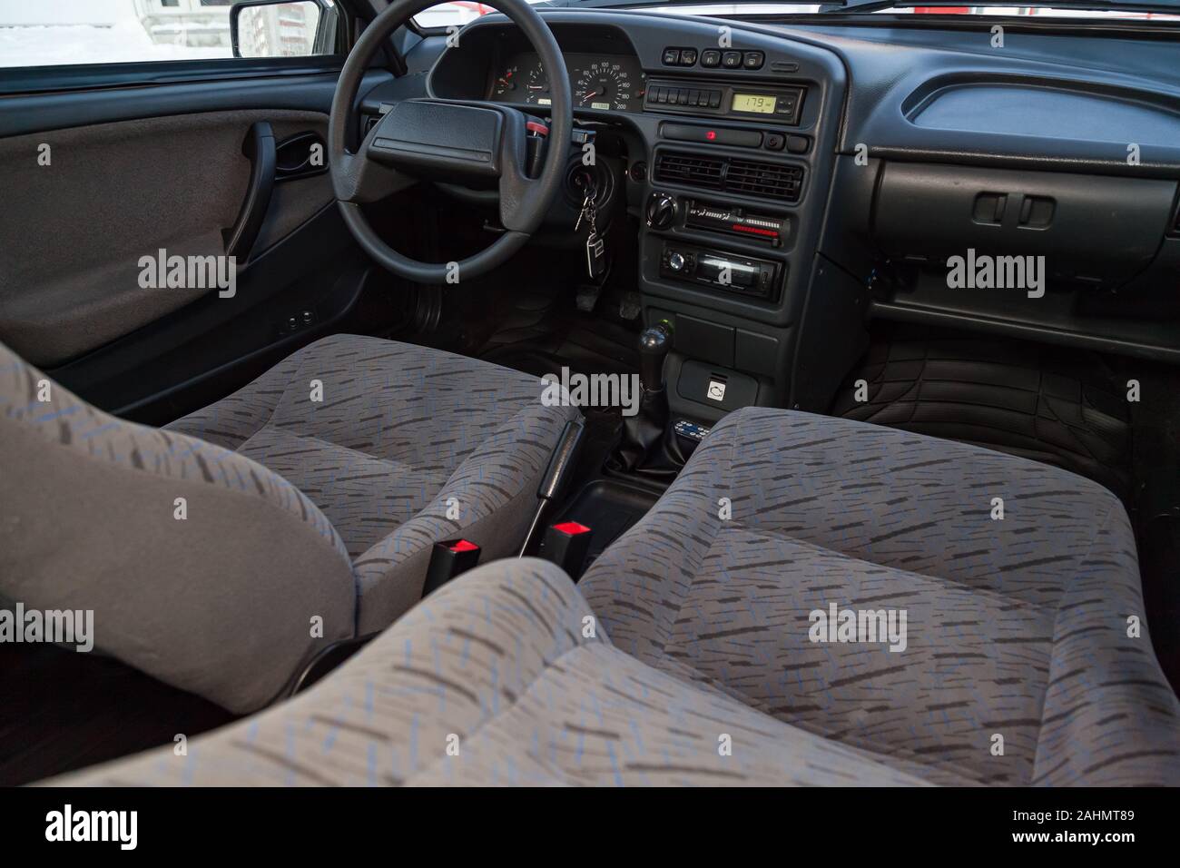 Novosibirsk, Russia - 12.27.2019: The interior of the car lada 2114 samara with a view of the steering wheel, dashboard, seats and multimedia system w Stock Photo
