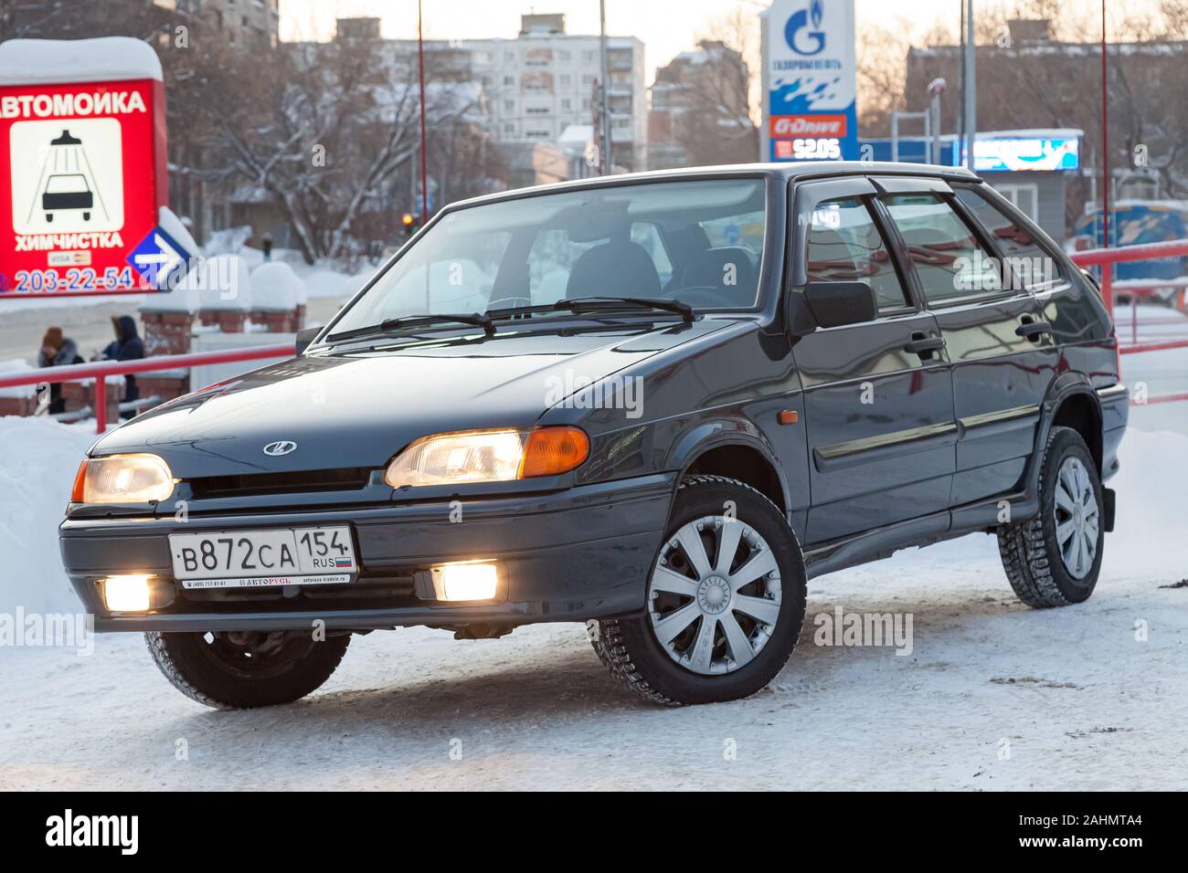 Novosibirsk, Russia - 12.26.2019: Green lada 2114 year front view with dark gray interior in excellent condition in a parking space among other cars Stock Photo