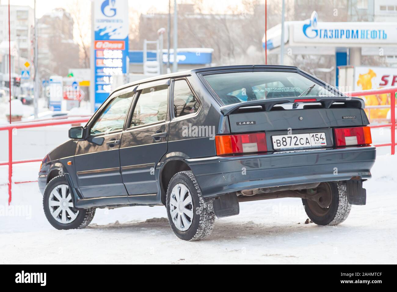 Novosibirsk, Russia - 12.27.2019: Green lada 2114 year front view with dark gray interior in excellent condition in a parking space among other cars Stock Photo