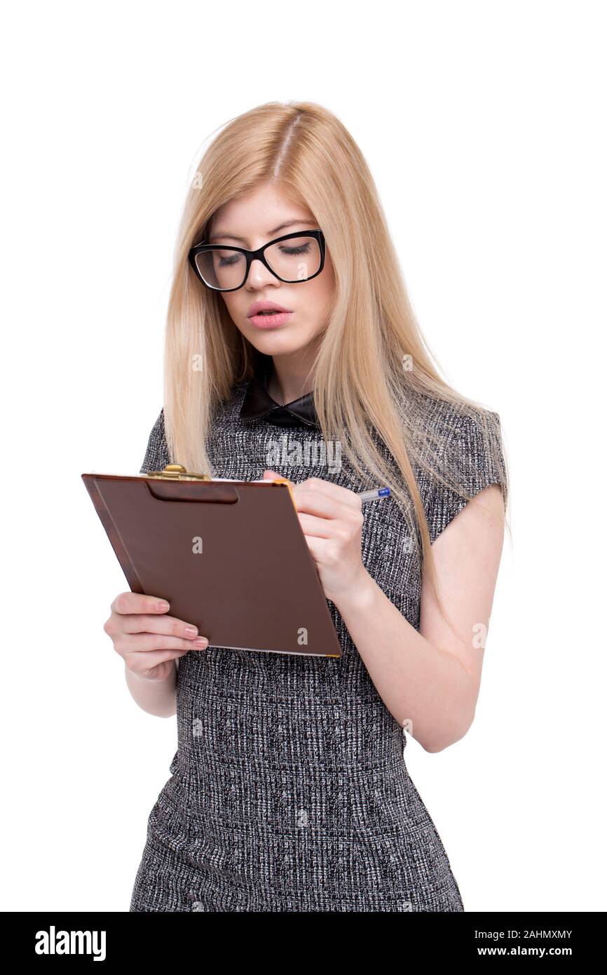 Smart woman in eyeglasses writing checklist on clipboard, isolated on white Stock Photo