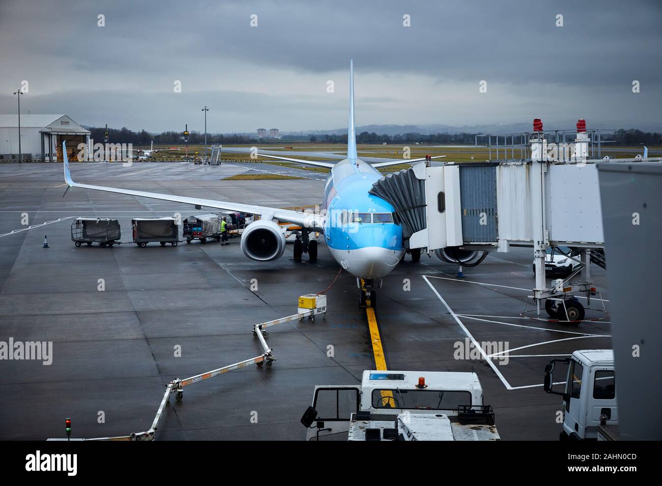 TUI 737 800 by Boeing on a gate at Glasgow Airport in Scotland Stock Photo
