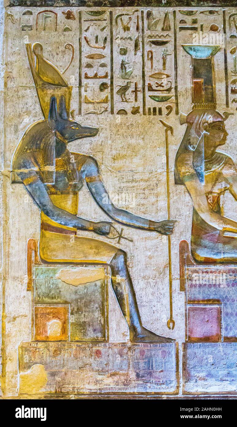 UNESCO World Heritage, Thebes in Egypt, ptolemaic temple of Deir el Medineh. The goddess Nephthys and the god Anubis seat on thrones. Stock Photo