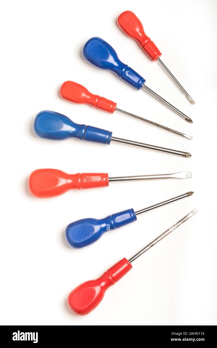 An array of red and blue handled screwdrivers for slotted and Phillips head screws Stock Photo