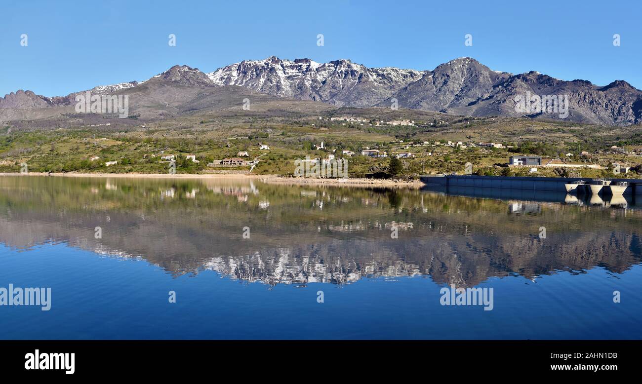 Monte Cinto Massif reflecting in Calacuccia Lake in Niolo region, Golo valley in Central Corsica, Natural Regional Park of Corsica, France Stock Photo