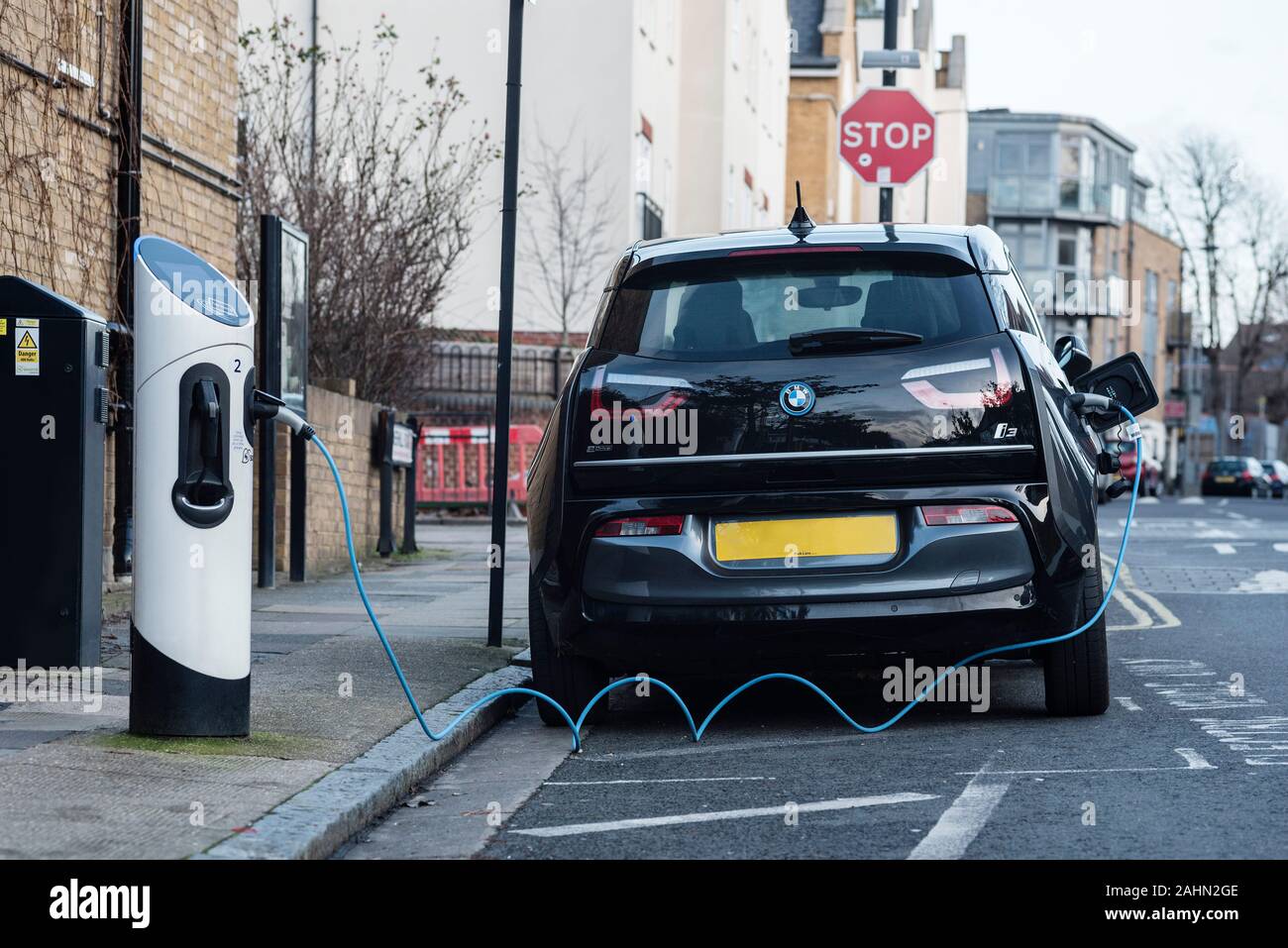 A car using an on street electric car charging bay. Measures to improve