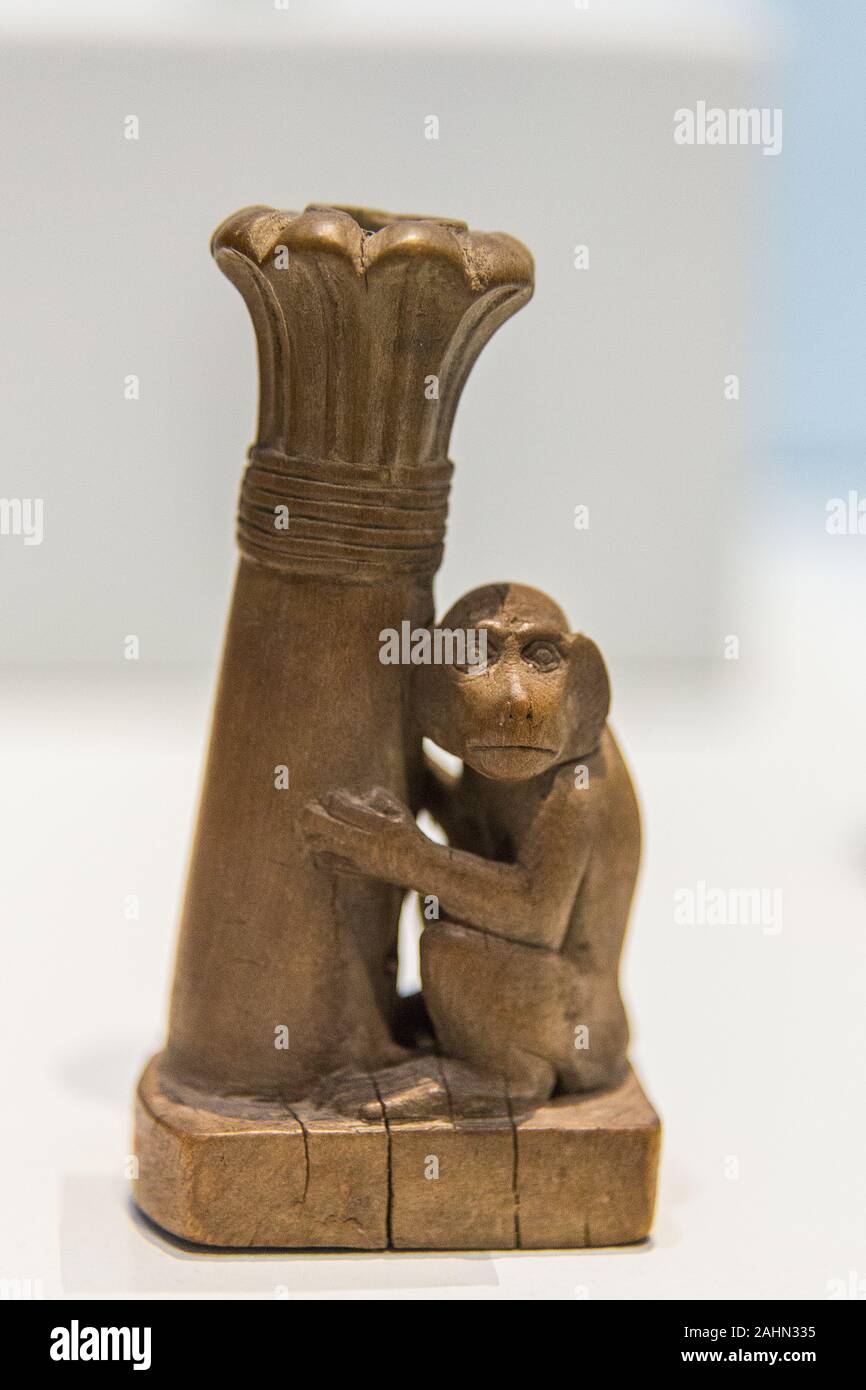Exhibition 'The animal kingdom in Ancient Egypt', organized in 2015 by the Louvre Museum.  Kohl tube, monkey holding a palm tree, New Kingdom, E 7985. Stock Photo