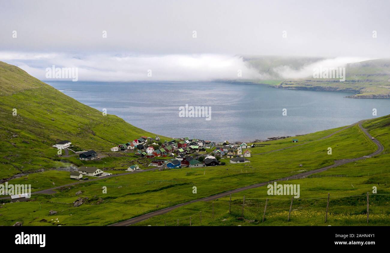 Funningsfjordur village and the fjord landscape in  Faroese island of Eysturoy Stock Photo