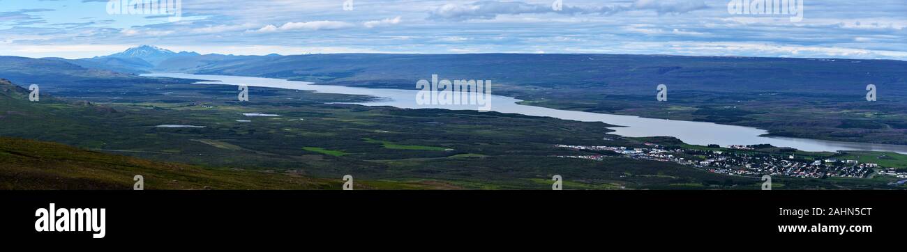 Panoramic view of Lagarfljot lake in Eastern Iceland, Egilsstadir town is at right the landscape of Fljotsdalshreppur municipality is at left backgrou Stock Photo
