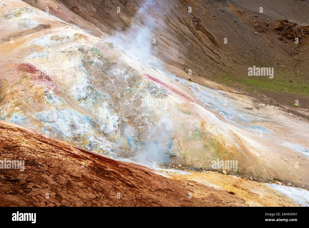 Solfatara and Fumarole activity in Krafla volcanic area in Northern Island. Sulfur deposits are in the ground surface of crater slope. Stock Photo