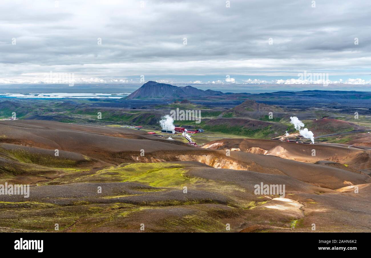 Volcanic Landscape of Krafla area in northern Iceland with Kroflustod geothermal power plant and Myvarn lake at left background, Nordurland eystra reg Stock Photo