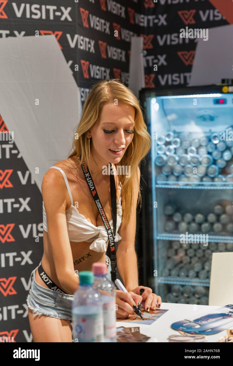 BERLIN, GERMANY - OCTOBER , 2019: Woman actress works at Visit-X online  porno video live sex cams booth during 23th Venus erotic and lifestyle  trade f Stock Photo - Alamy