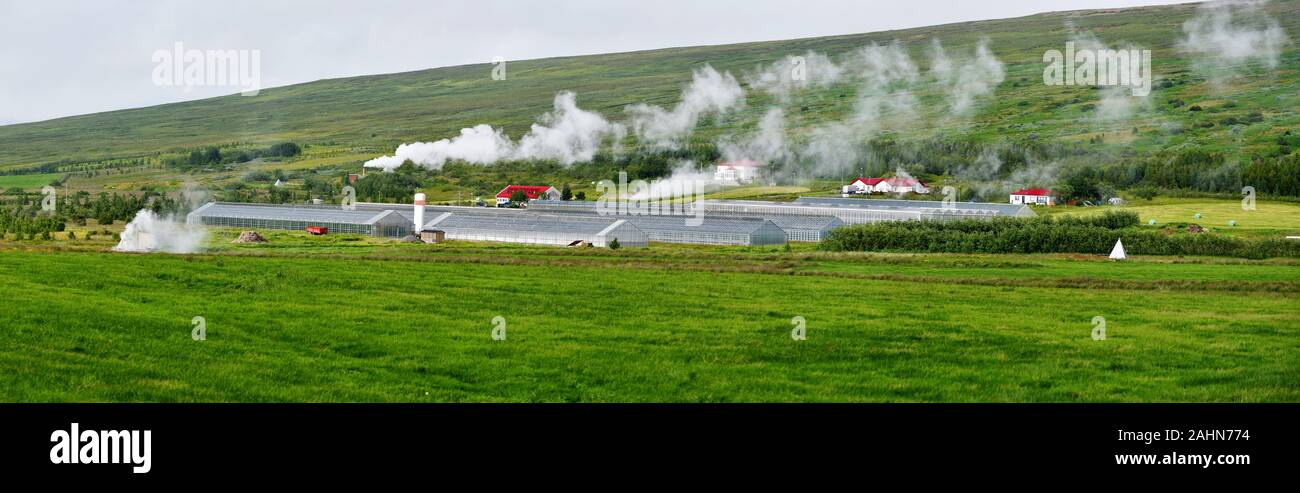 Panoramic view at greenhouses farm heated with hydrothermal sources in  Skutustadahreppur region of Northern Iceland. Stock Photo