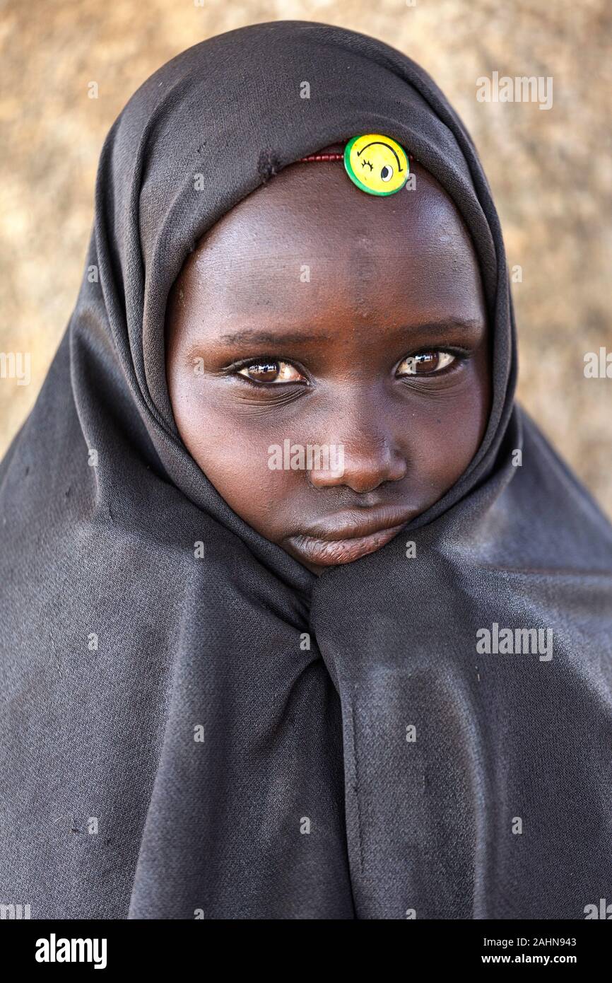 Portrait of a beautiful Arbore girl with a blanket covering over her