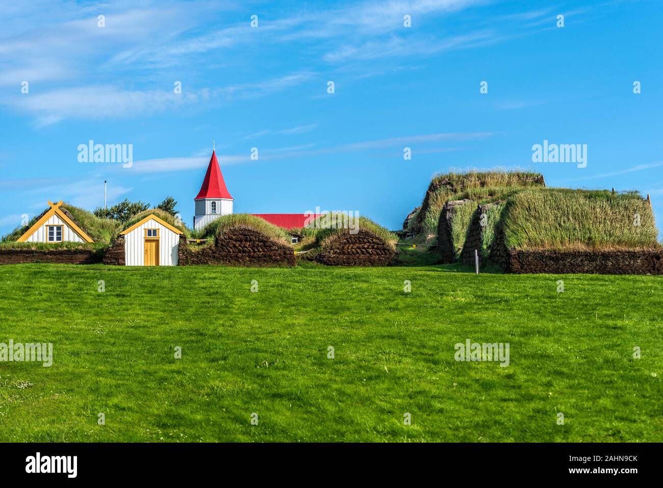 Traditional Icelandic farm  Glaumbaer composed of turf houses in Northern Iceland, as seen from the South door, the top of the wooden church is behind Stock Photo