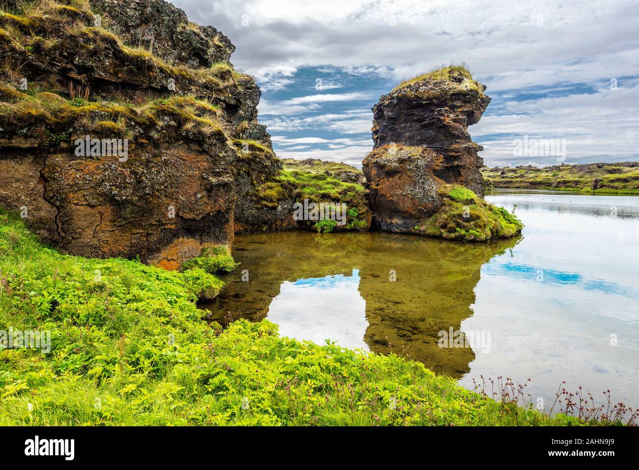 View at lava pillars of Hofdi promontory in Mytavn lake area in Northern Iceland. Stock Photo